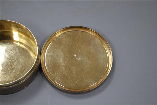 A late 19th/early 20th century French engine turned 950 standard white metal circular box and cover,